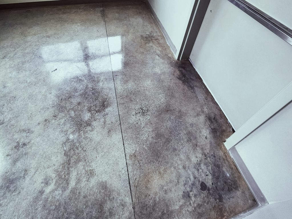 concrete floor with gray and black coating and sealer