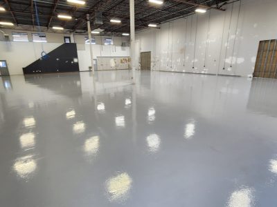 large high gloss gray concrete epoxy coated floor