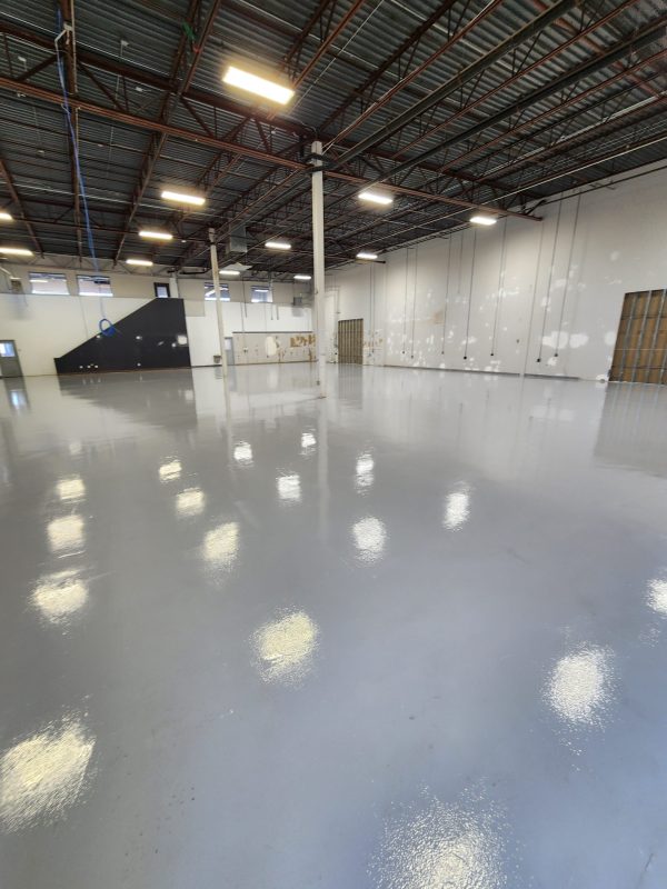 large high gloss gray concrete epoxy coated floor