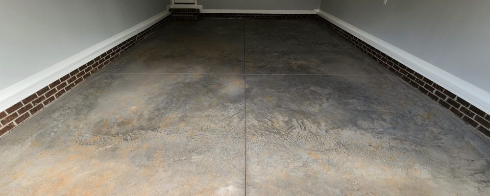 garage floor that has been power troweled in preparation for epoxy coating