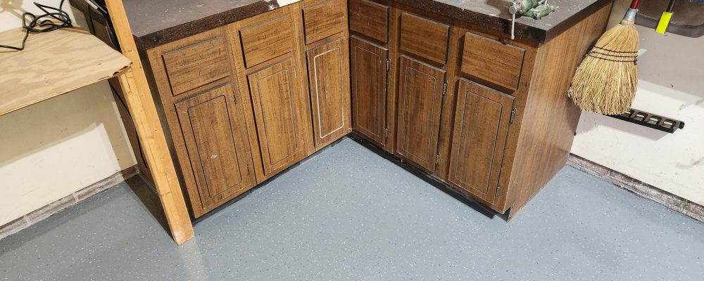 After image of the stained concrete floor with a clean, bright epoxy coating with partial blake.